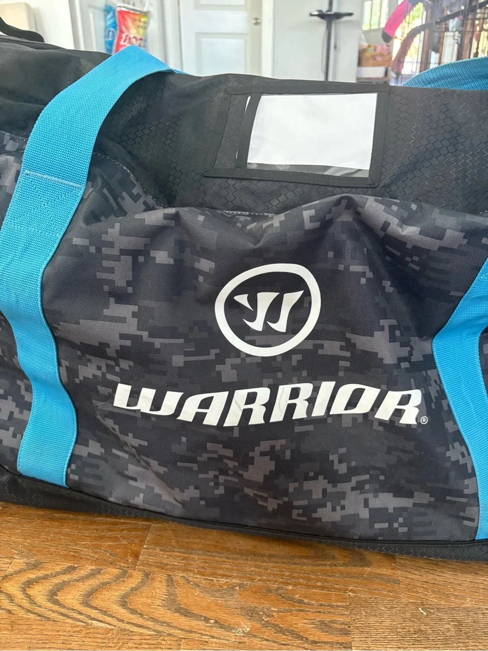 Men's hockey Duffle Bag in Black Digital Camo with Blue Accents wheeled